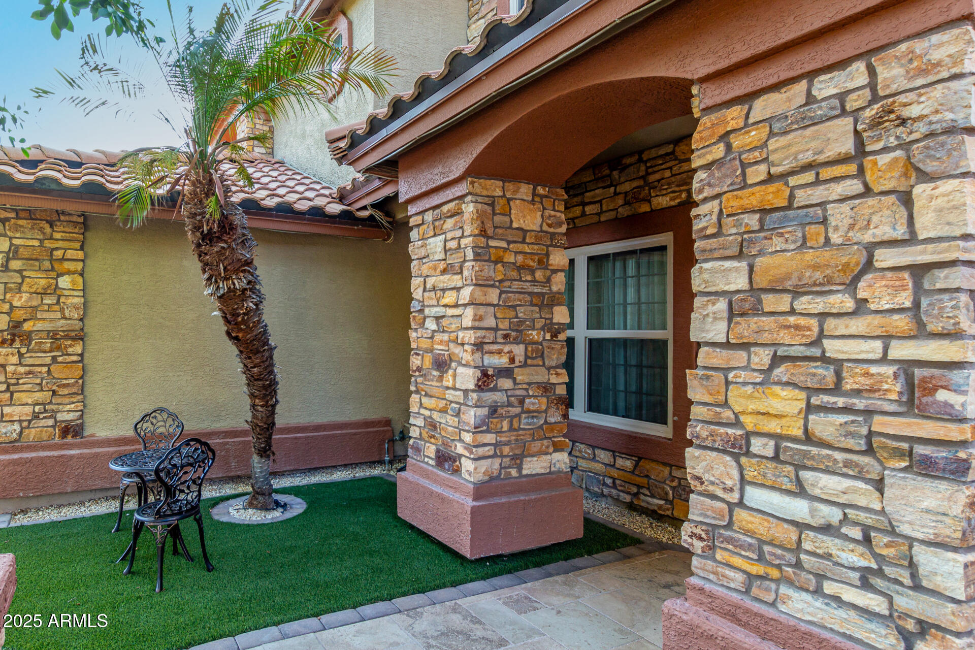 5956 East Phelps Road Scottsdale, AZ 85254 - Photo 8 of 60 a front view of a house with garden