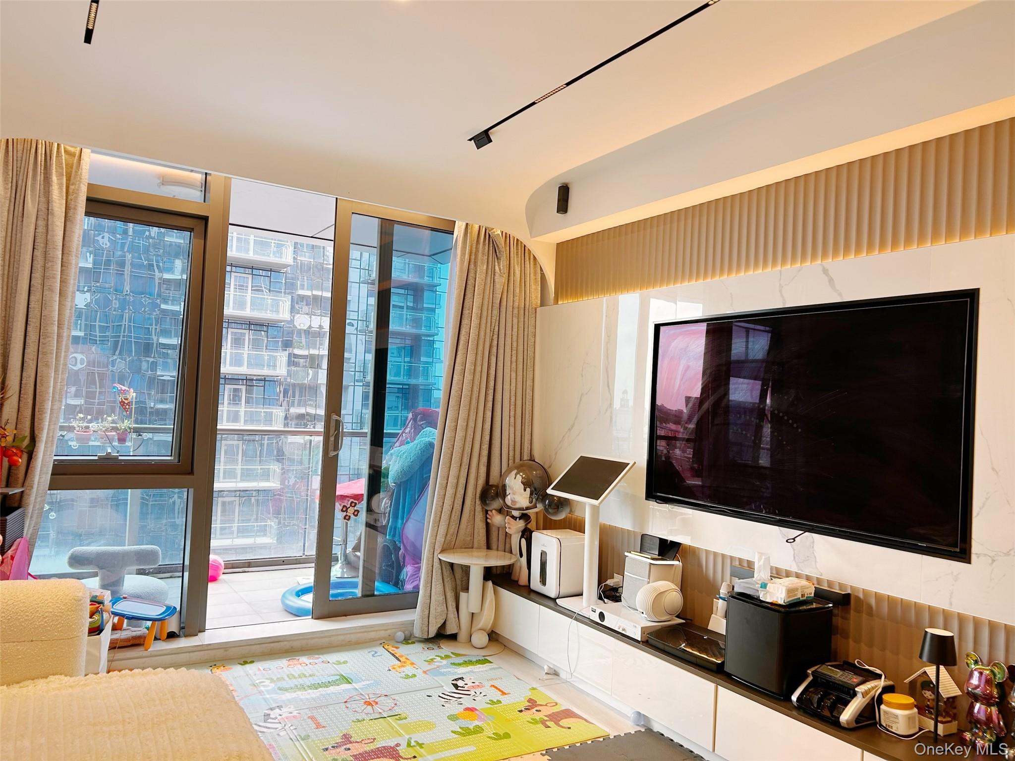 33-66 Farrington Street, Unit 9K Queens, NY 11354 - Photo 4 of 9 Rec room featuring floor to ceiling windows