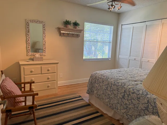 a bedroom with a bed and chair