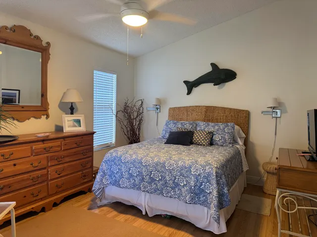 a bedroom with a bed and a dresser