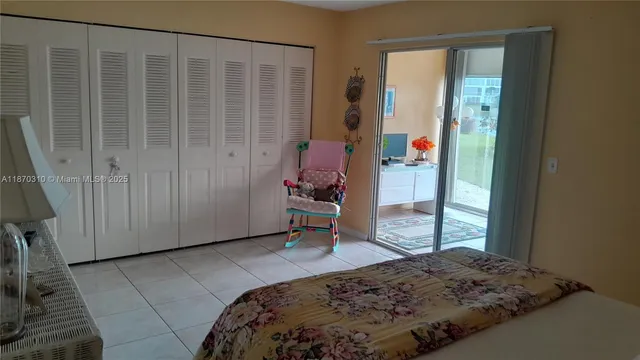 a bathroom with a granite countertop toilet sink and mirror