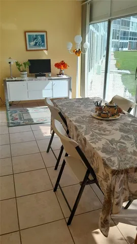 a table that has a table and chairs in it