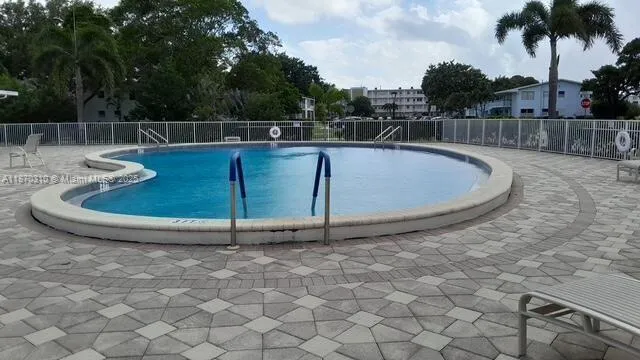 a view of swimming pool from a balcony