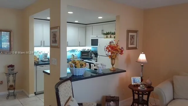 a vase of flowers sitting on a table