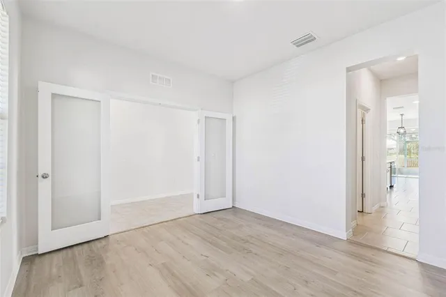 a view of an entryway with wooden floor