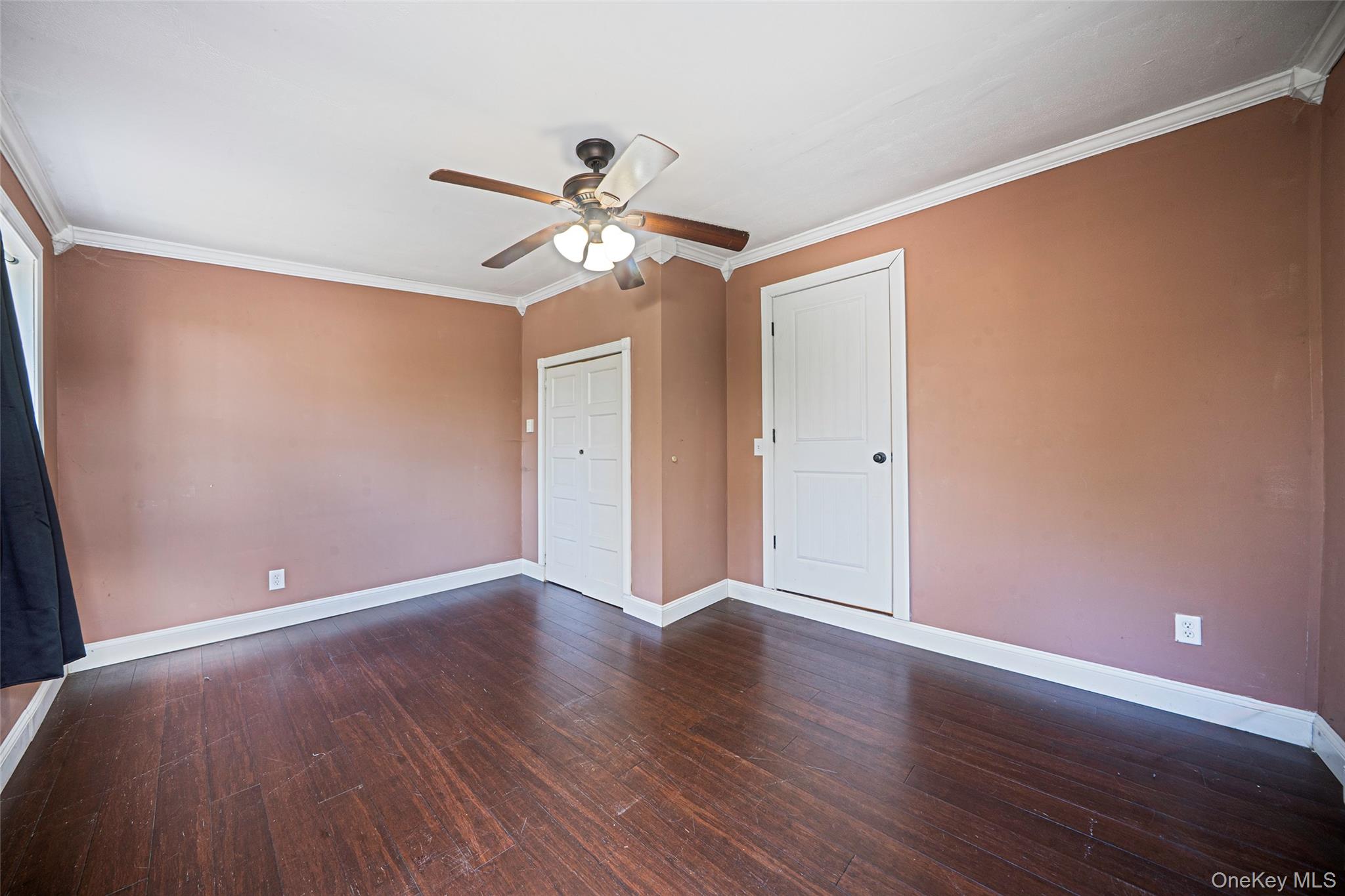 93 Maple Road Kings Park, NY 11754 - Photo 9 of 24 wooden floor in an empty room with a window