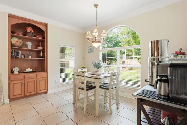 a view of a dining room with furniture window and outside view