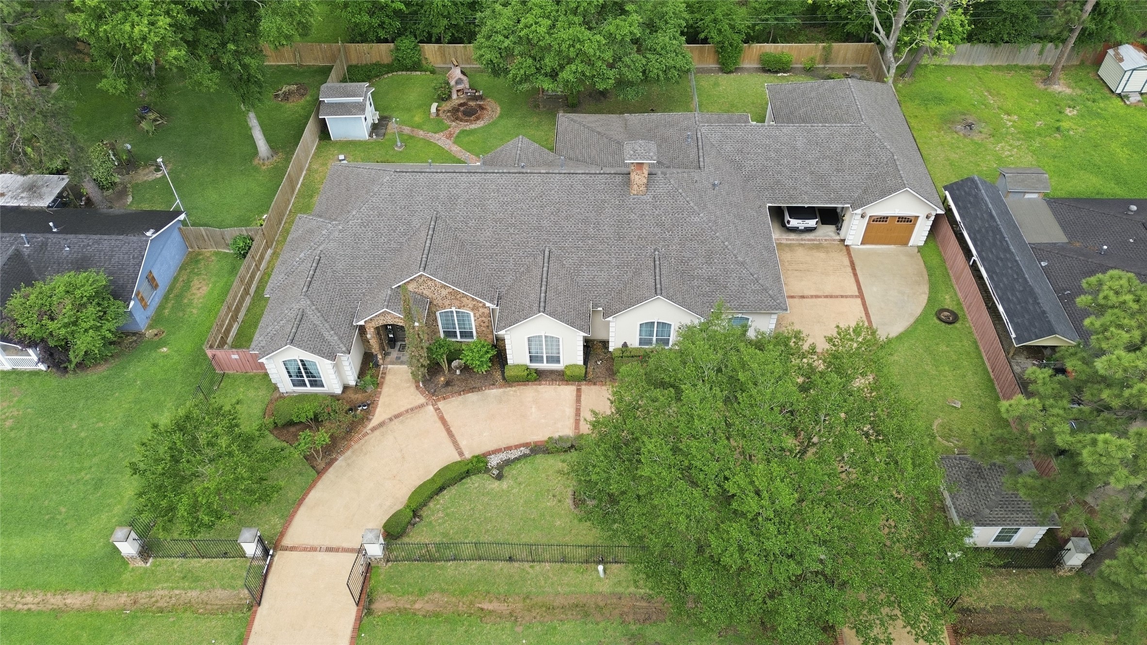 21411 Stargrass Drive Spring, TX 77388 - Photo 2 of 24 Stunning aerial view of this expansive 2 lot property, featuring a circular driveway and lush professional landscaping on a sprawling lot.
