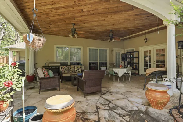 a outdoor living space with furniture and a potted plant