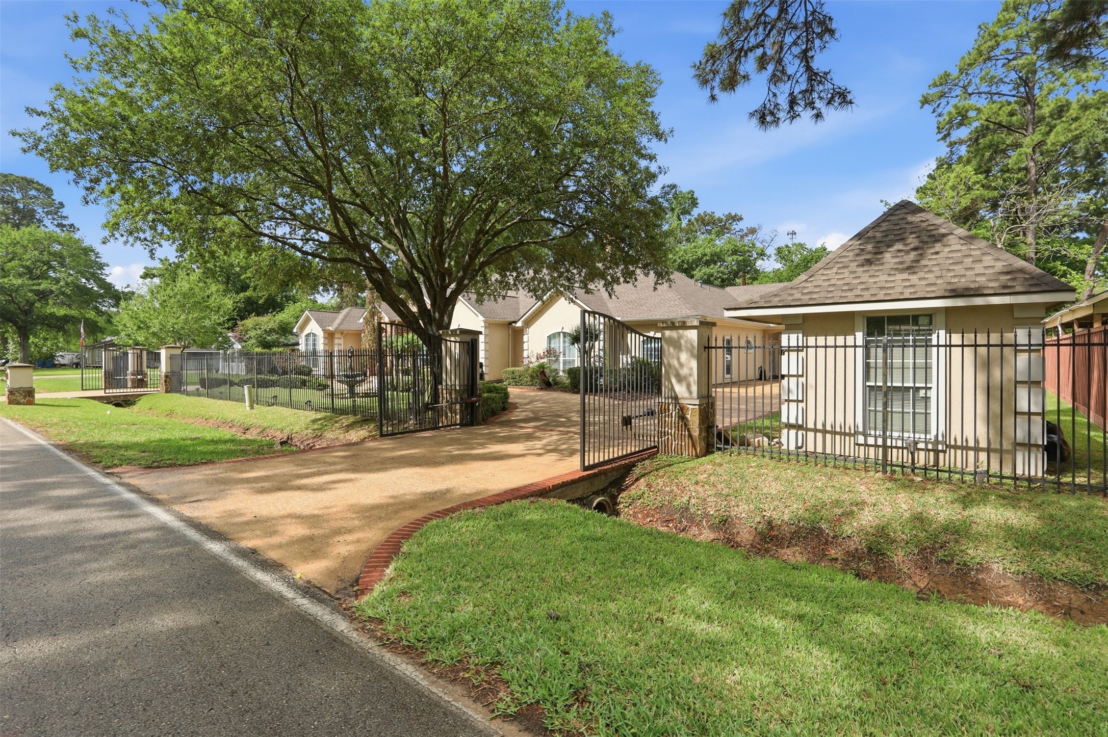 21411 Stargrass Drive Spring, TX 77388 - Photo 6 of 24 Remote controlled iron gates.