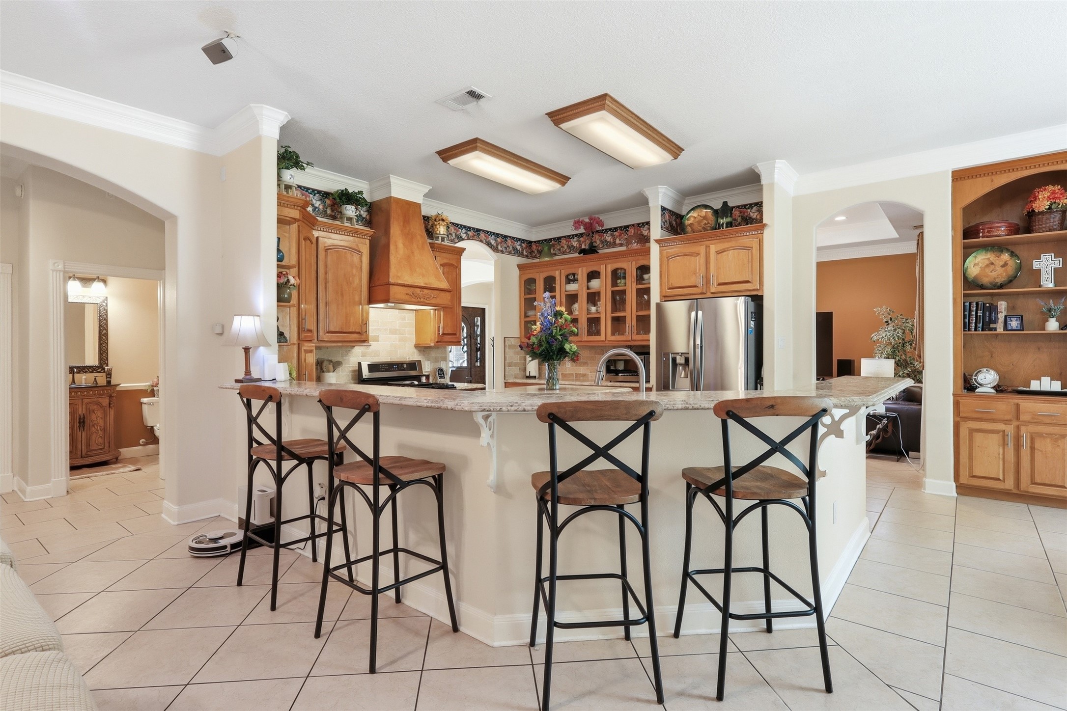 21411 Stargrass Drive Spring, TX 77388 - Photo 10 of 24 Incredible storage and style! Highlighted by custom wood cabinetry, granite countertops, and a built-in display hutch.