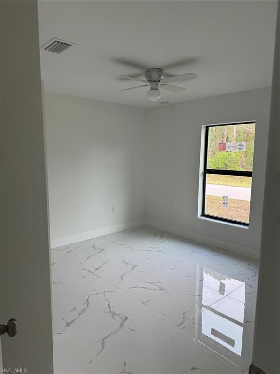 2530 Catron Circle Lehigh Acres, FL 33971 - Photo 19 of 27 a view of an empty room with a window