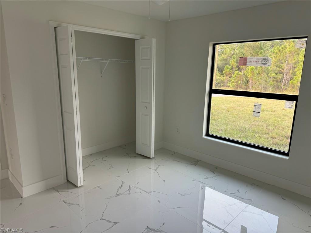 2530 Catron Circle Lehigh Acres, FL 33971 - Photo 23 of 27 a view of an empty room with a window