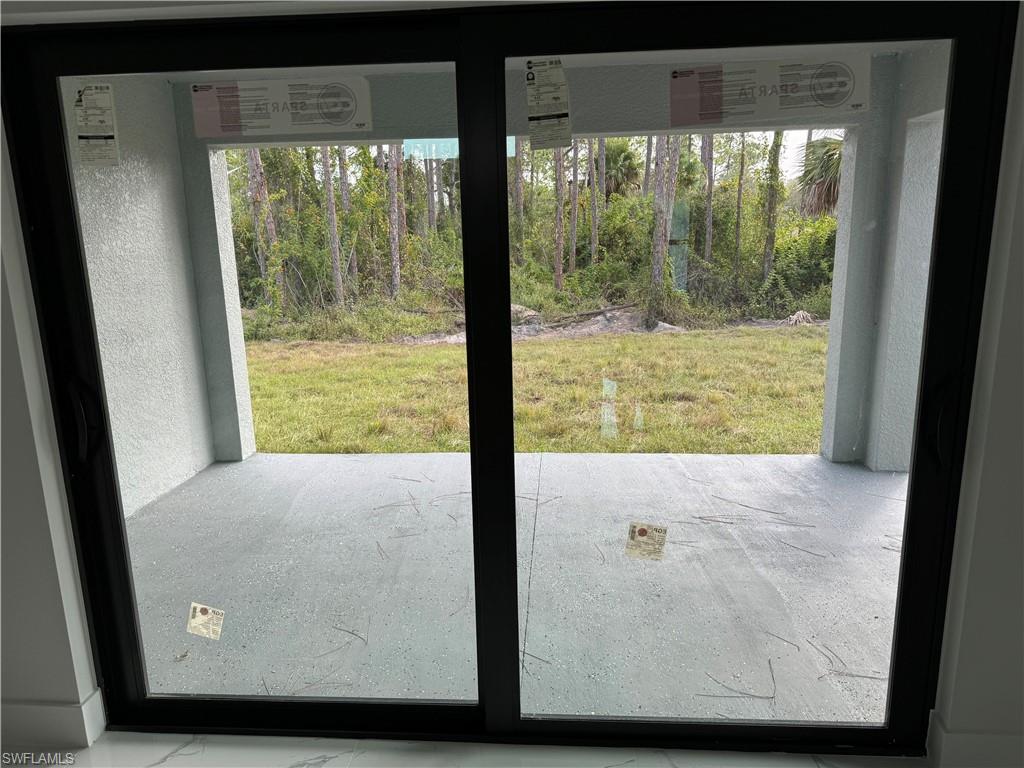 2530 Catron Circle Lehigh Acres, FL 33971 - Photo 26 of 27 a view of a living room and windows