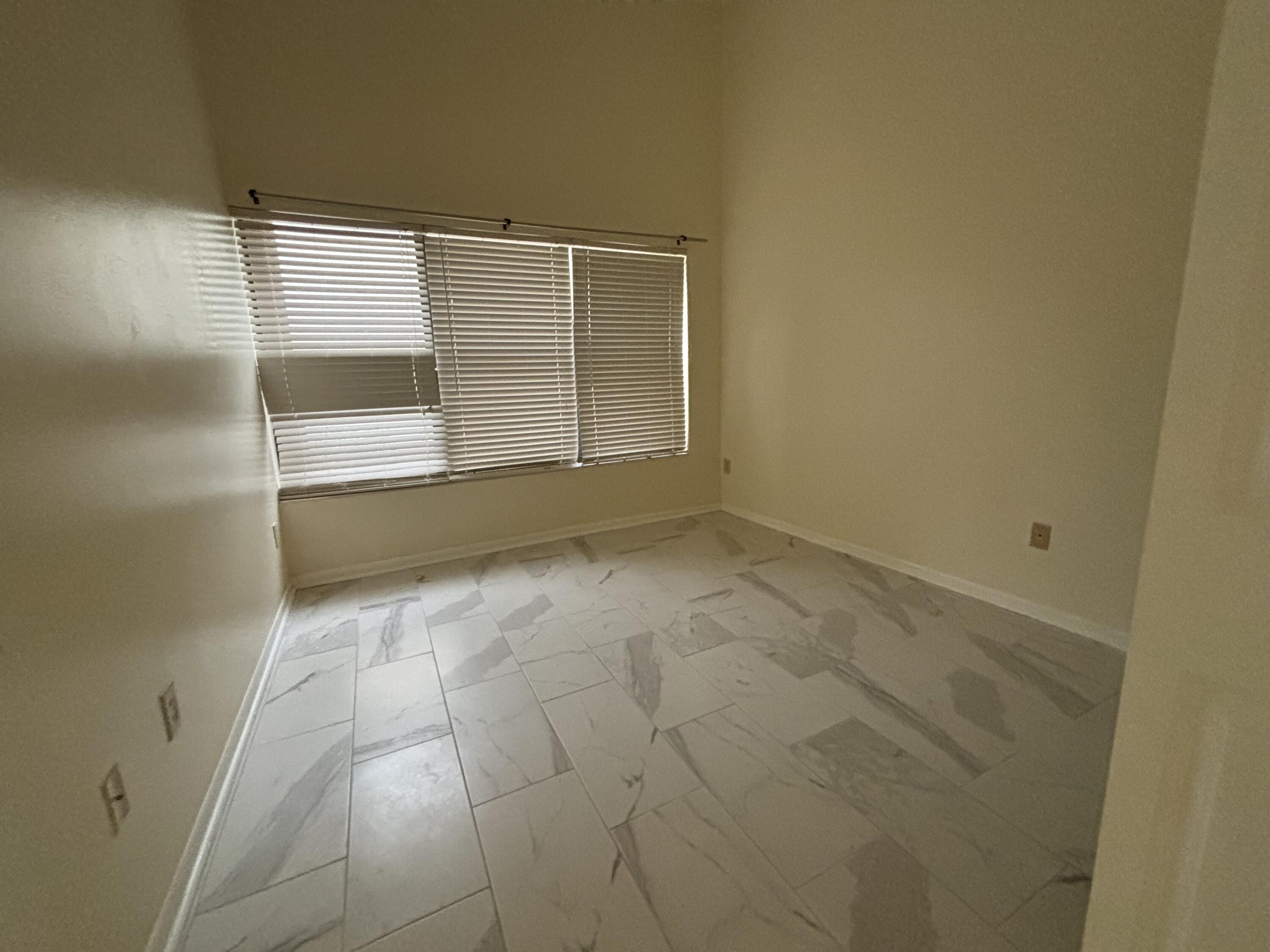 3872 Vine Trail, Unit D Lake Worth, FL 33467 - Photo 15 of 18 a view of an empty room with a fireplace