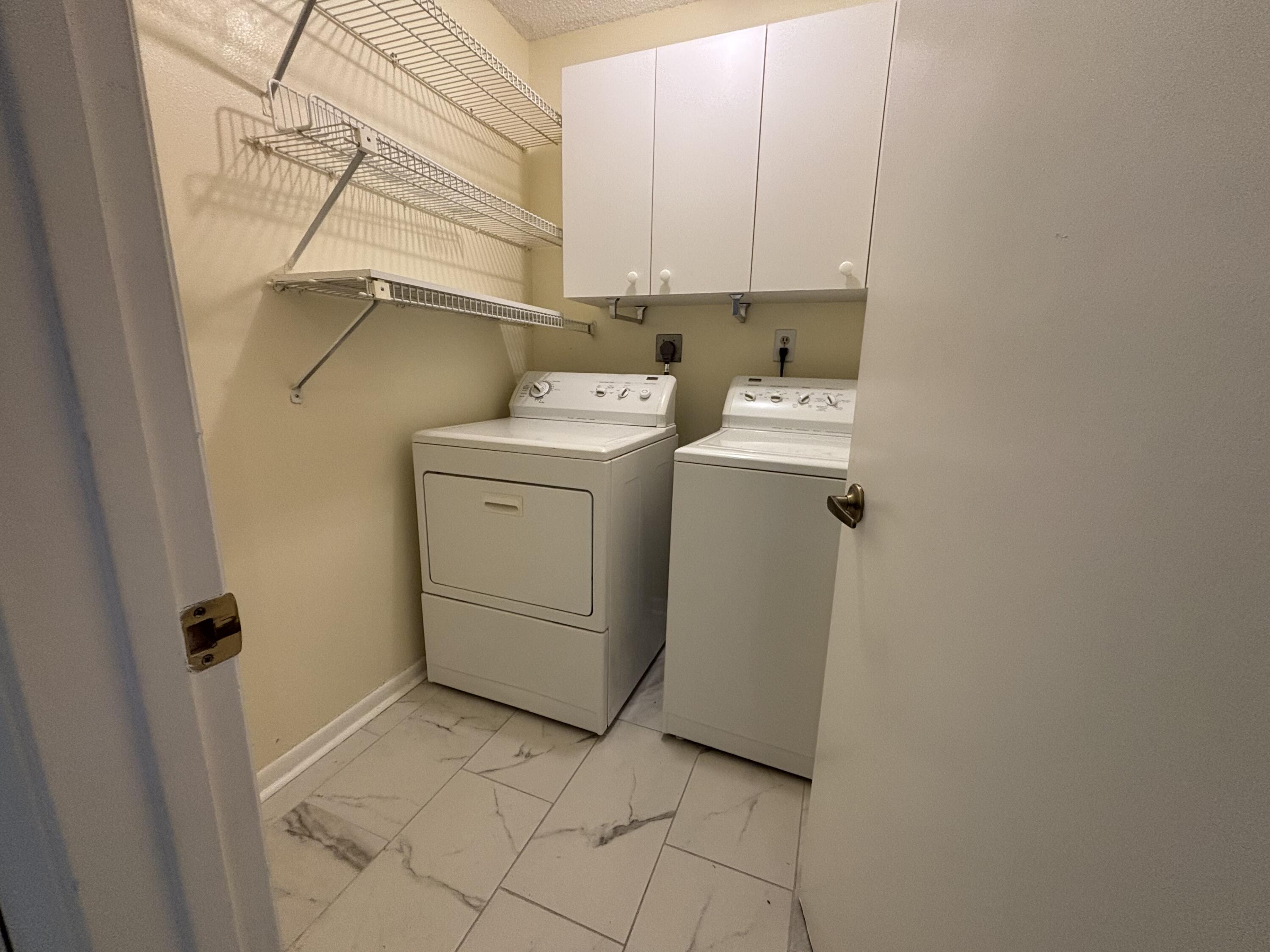 3872 Vine Trail, Unit D Lake Worth, FL 33467 - Photo 17 of 18 a utility room with dryer and washer