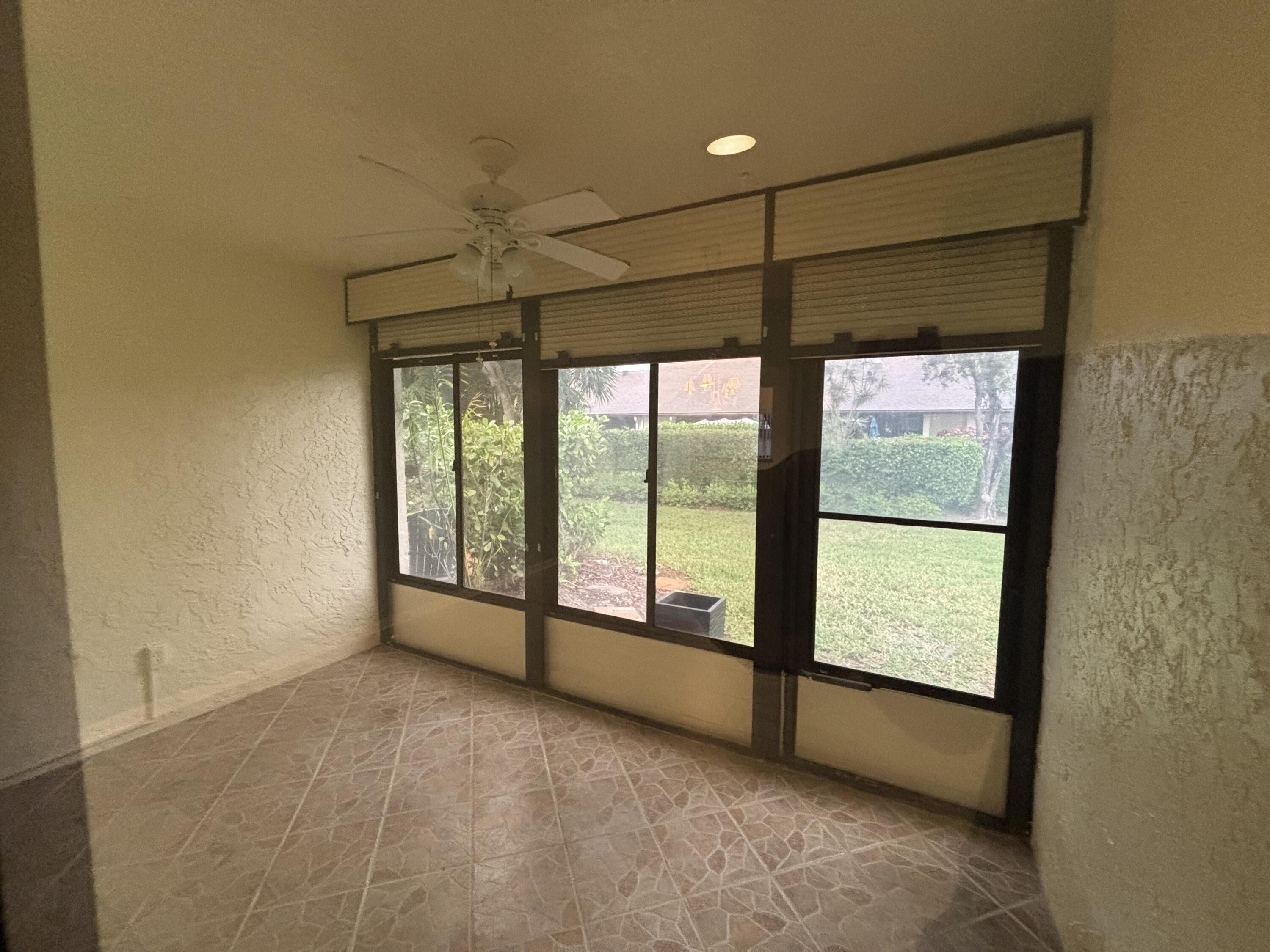 3872 Vine Trail, Unit D Lake Worth, FL 33467 - Photo 18 of 18 a view of an empty room with a window