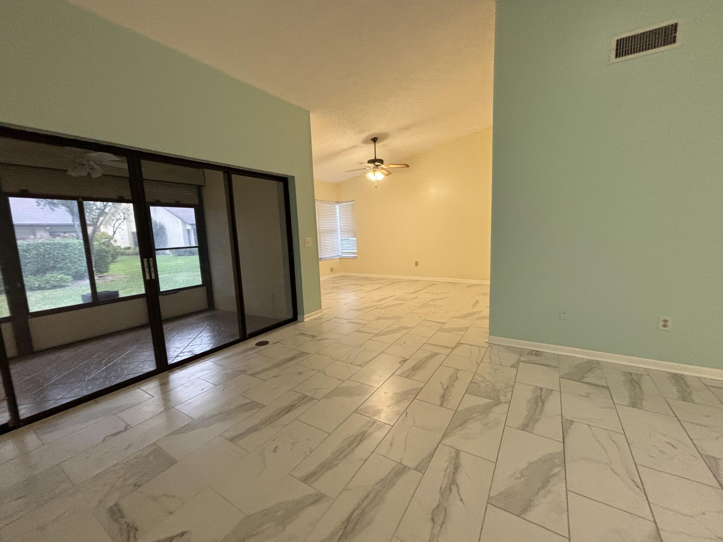3872 Vine Trail, Unit D Lake Worth, FL 33467 - Photo 8 of 18 a view of hallway with stairs