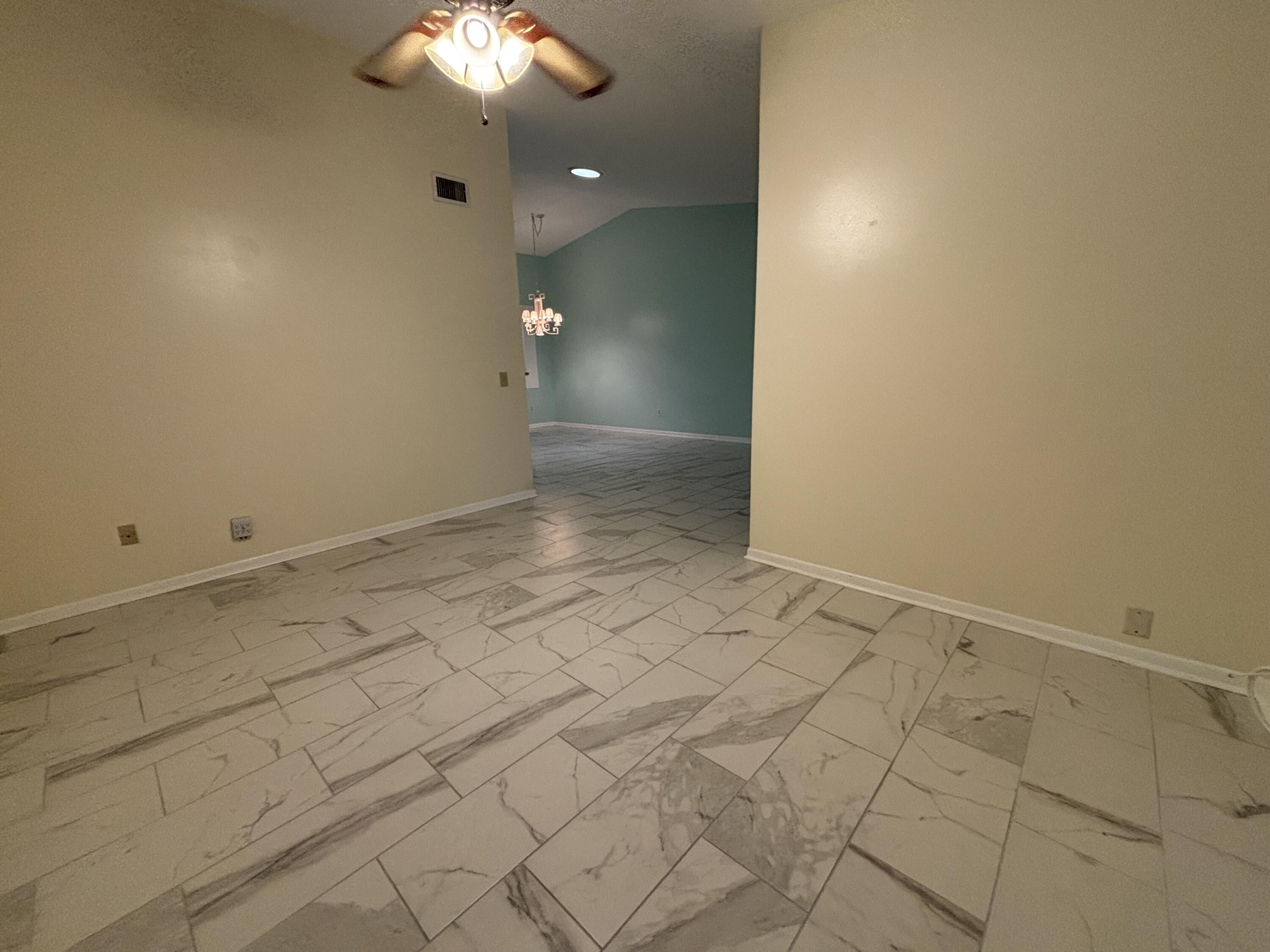 3872 Vine Trail, Unit D Lake Worth, FL 33467 - Photo 10 of 18 wooden floor in an empty room
