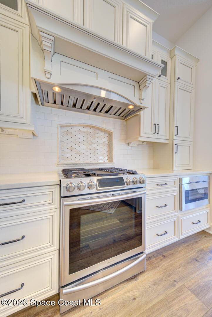 4070 Stoney Point Road Melbourne, FL 32940 - Photo 13 of 78 kitchen with gas range & hood