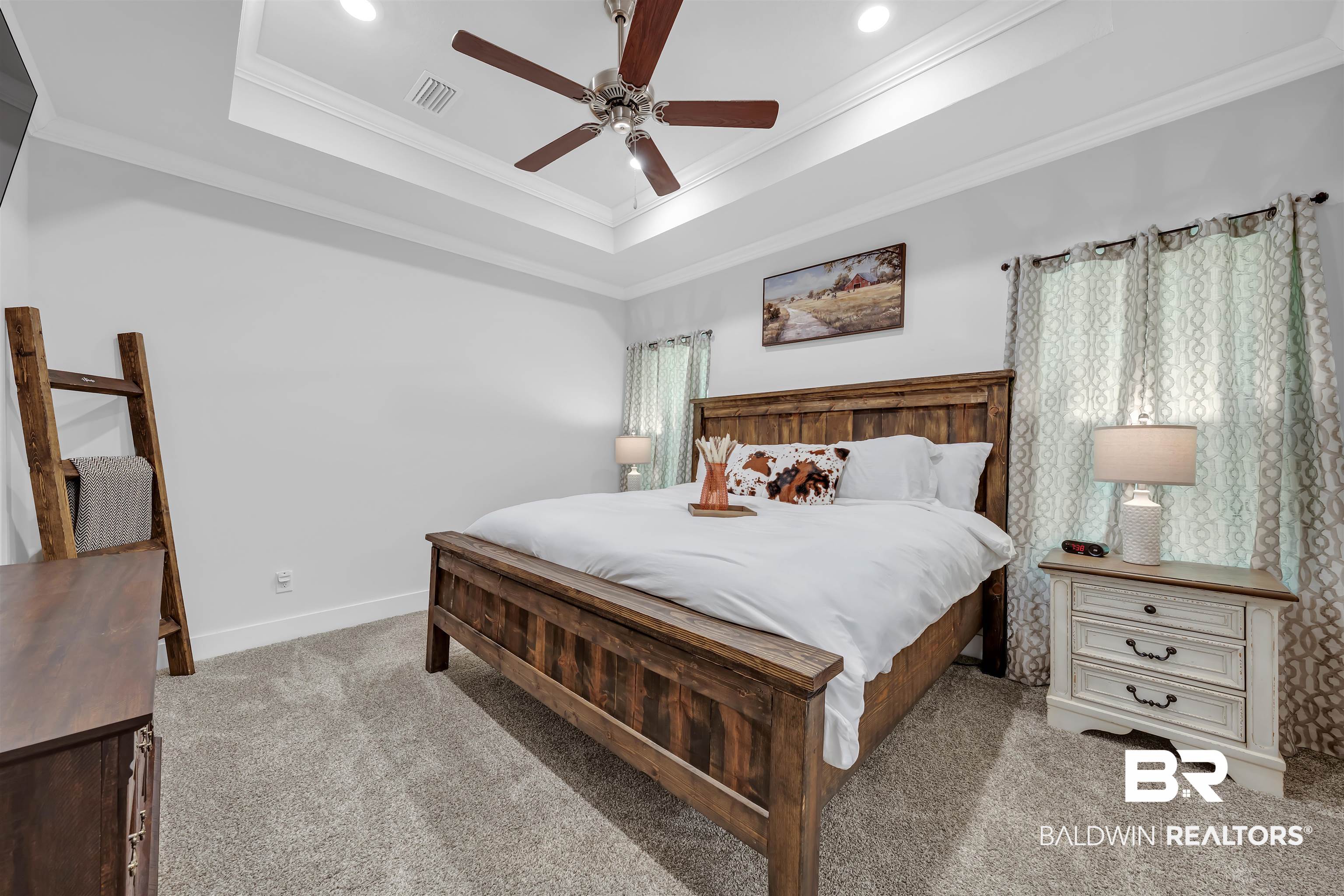 16504 Prado Loop Loxley, AL 36551 - Photo 25 of 45 Carpeted bedroom featuring ornamental molding, a ceiling fan, a tray ceiling, and recessed lighting