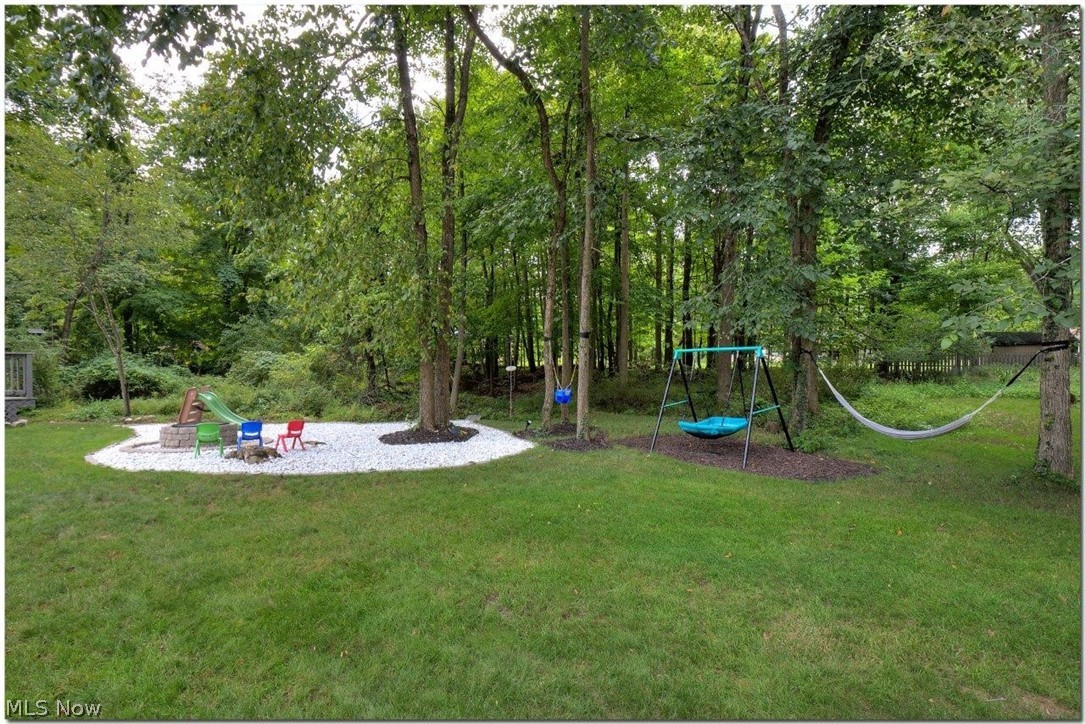3200 Lander Road Pepper Pike, OH 44124 - Photo 34 of 35 Situated on 1.05 acres.
Fabulous deck overlooks the large backyard with fire pit and
wooded views