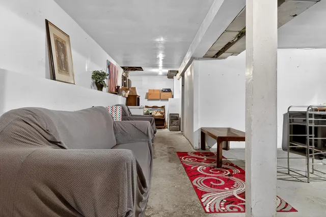 a living room with furniture and a table