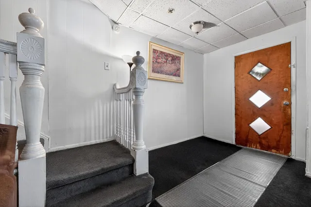 a living room with a couch and a rug