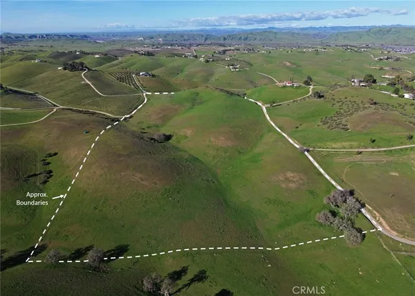 an aerial view of a residential houses with outdoor space