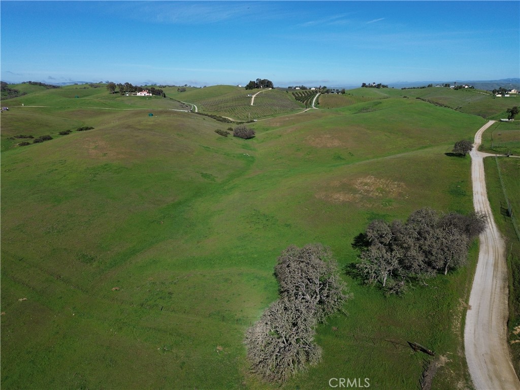 1641 Sutliff Road Paso Robles, CA 93446 - Photo 29 of 44 a view of a lake with a building in the background