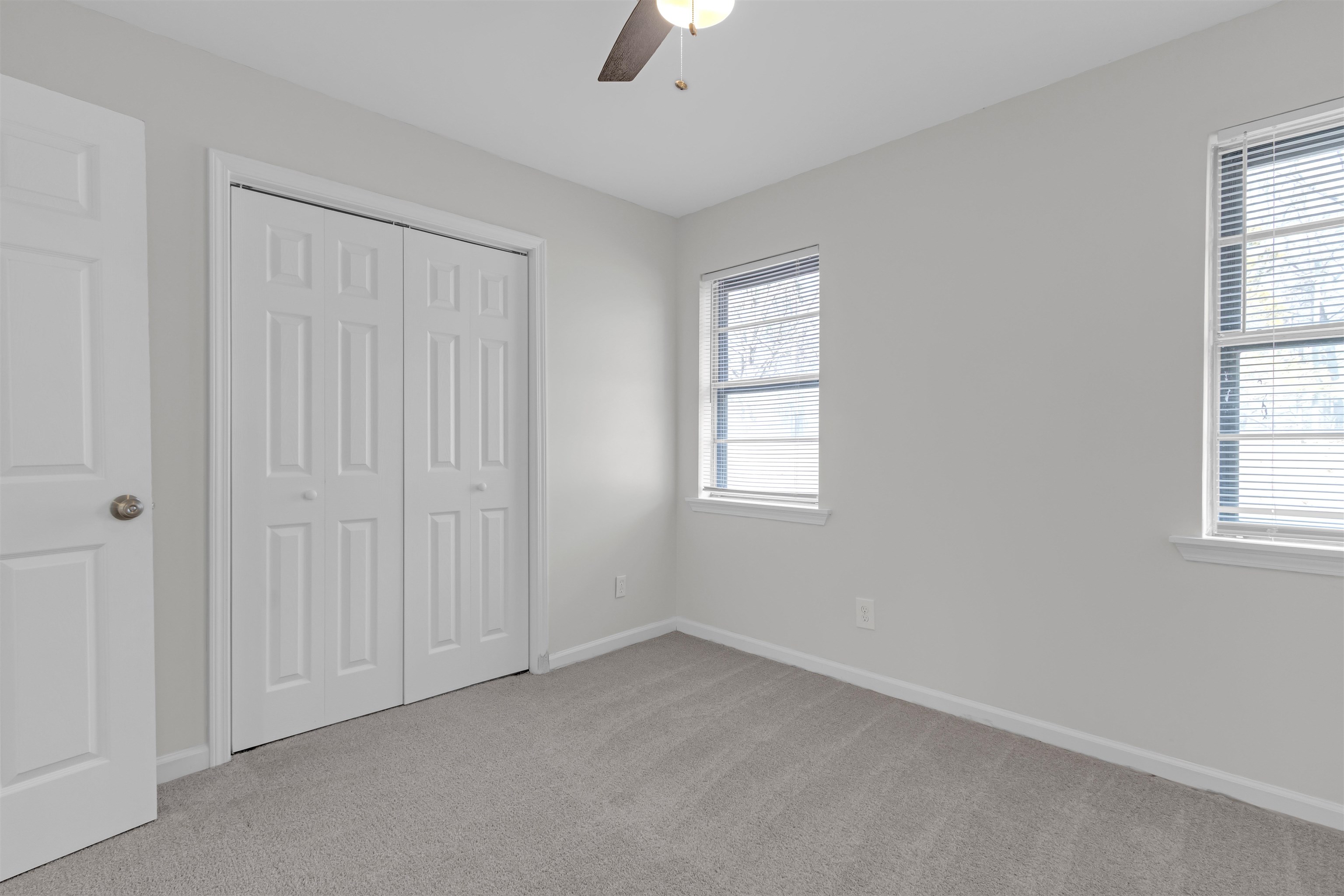 1296 Monasco Road Millington, TN 38053 - Photo 26 of 32 an empty room with chandelier fan and windows