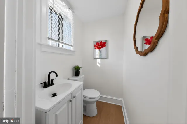 a bathroom with a toilet and a sink