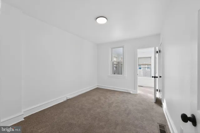 a bathroom with a sink a toilet a shower and a mirror