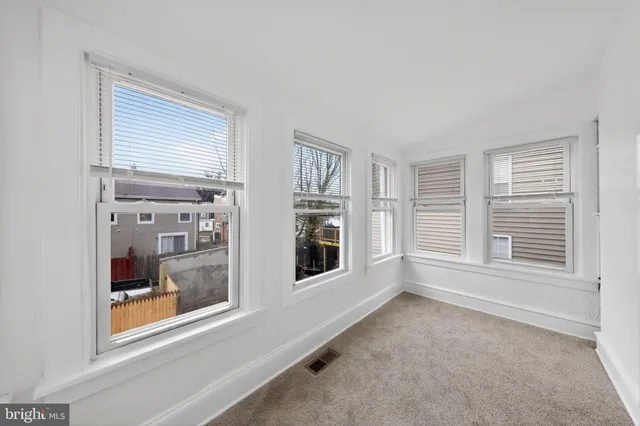 a view of a house with a snow in the background