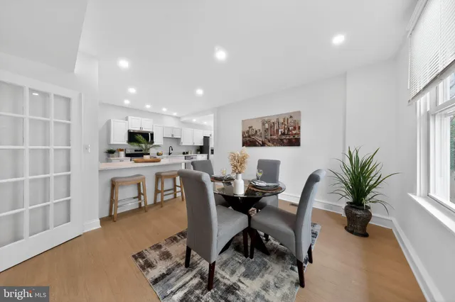 a view of a workspace with furniture and a kitchen