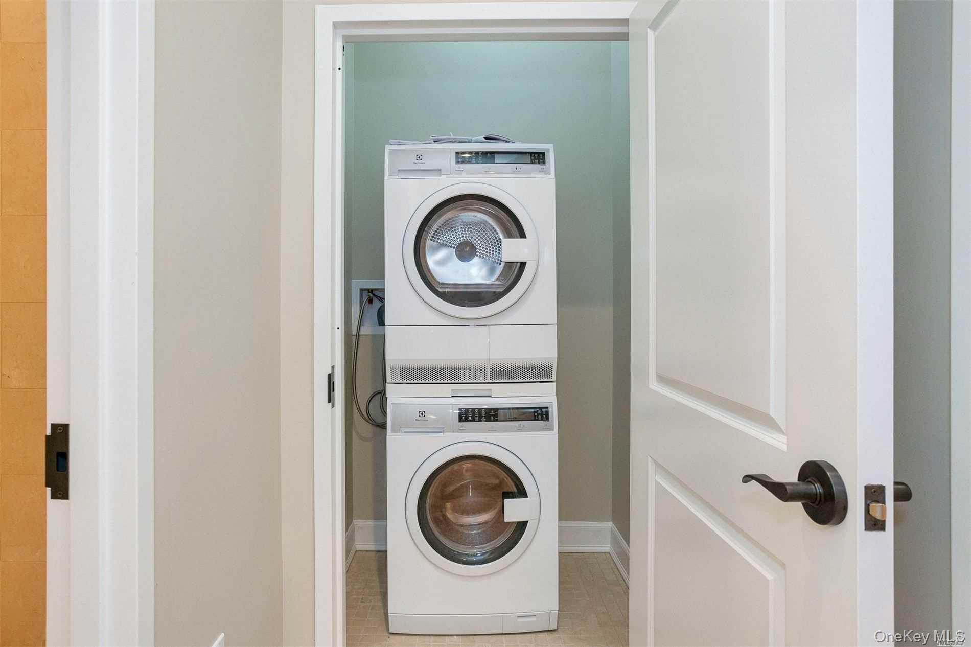 10 Wall Street, Unit 3A Huntington, NY 11743 - Photo 11 of 22 a utility room with dryer and washer