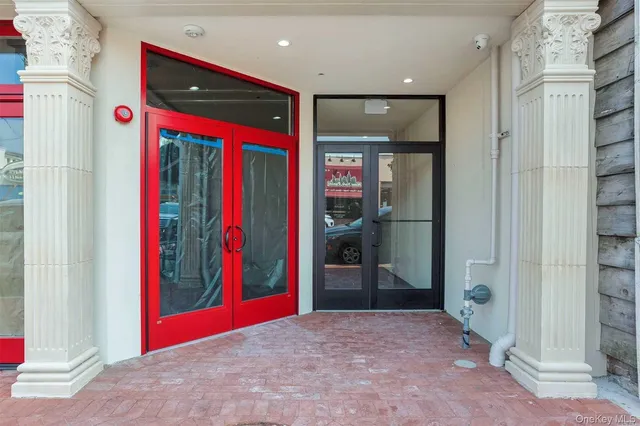 a view of a hallway with furniture and closet