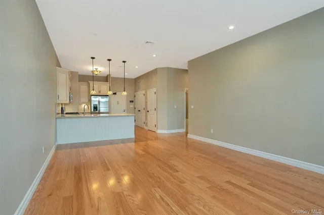 a view of kitchen with wooden floor