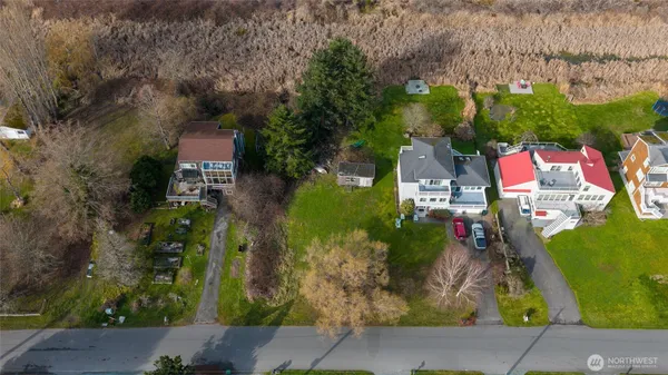 an aerial view of houses with yard