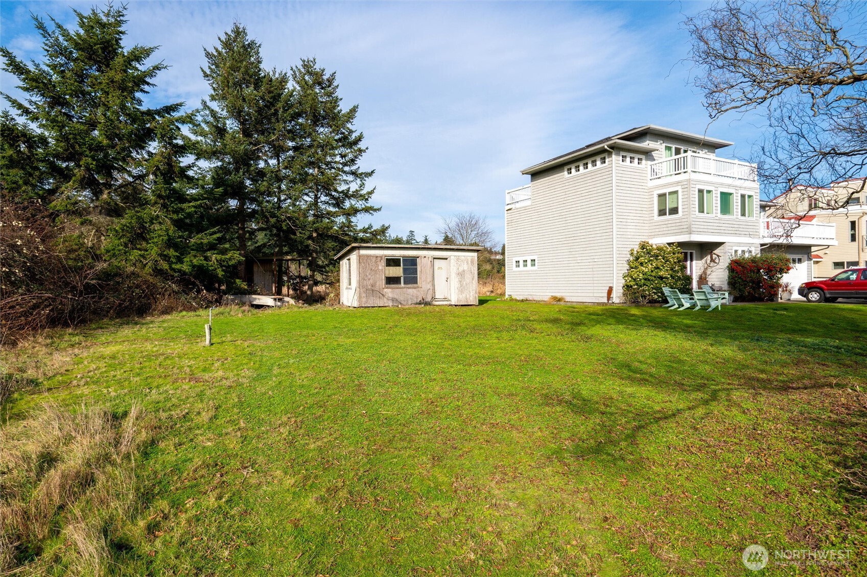 0 Shore Avenue Freeland, WA 98249 - Photo 9 of 20 a front view of a house with garden