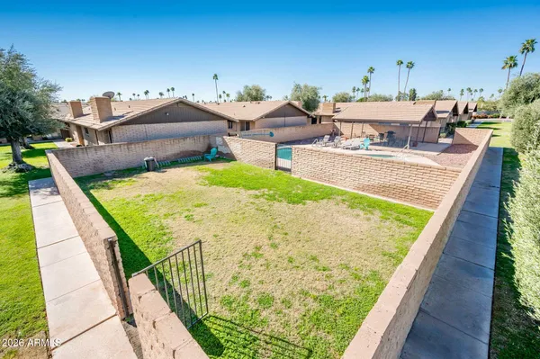 a view of a swimming pool with a patio