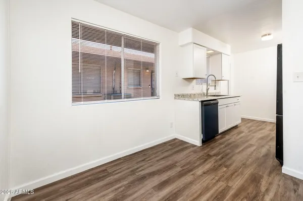 a view of a kitchen from the hallway