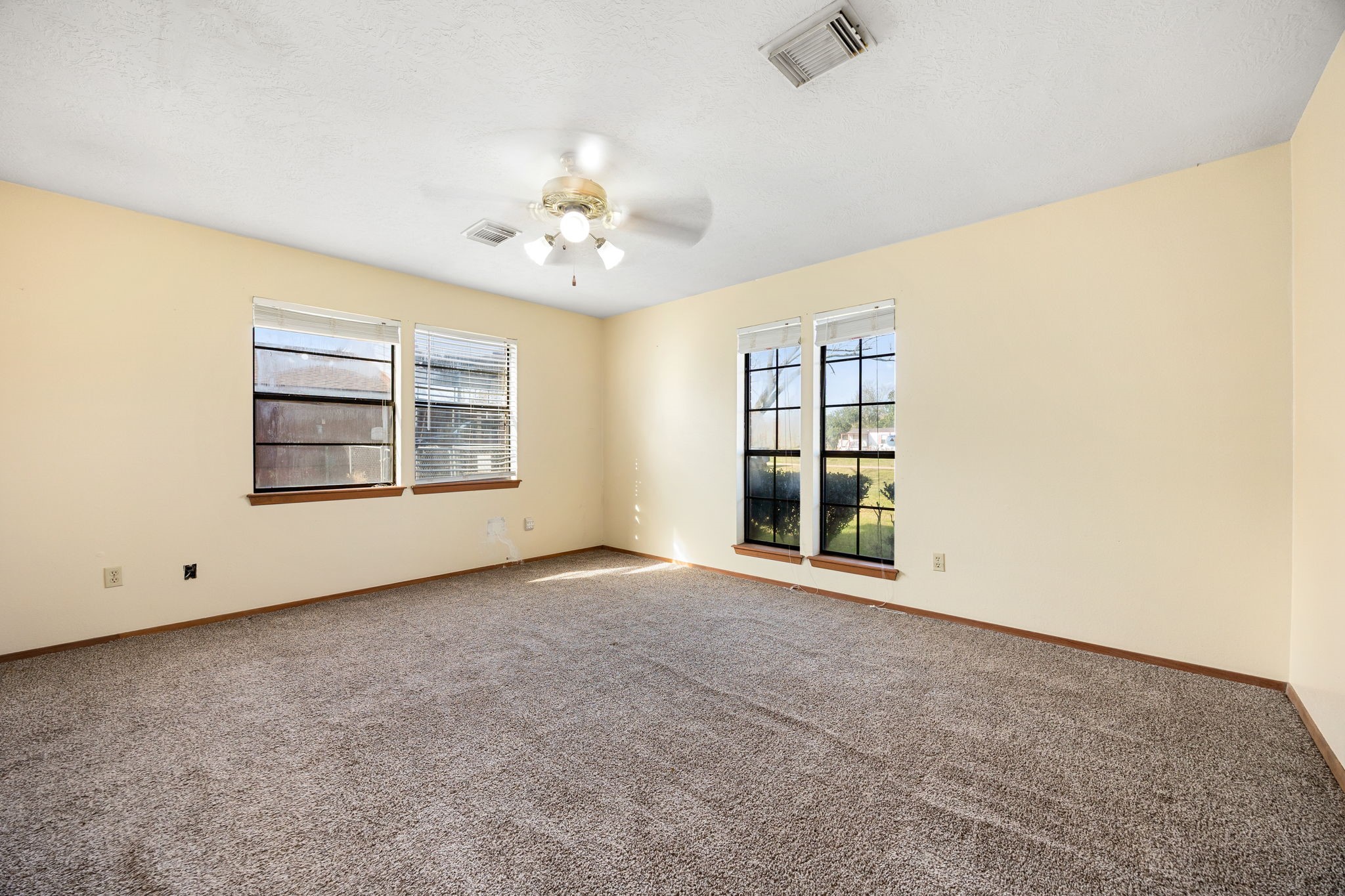 236 Pine Ridge Drive Cleveland, TX 77327 - Photo 7 of 22 Primary bedroom with open natural light and fresh carpet