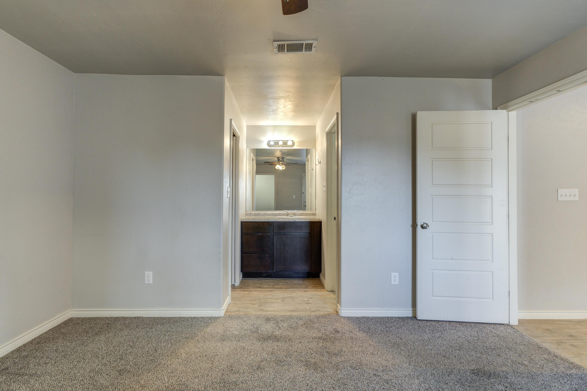 4320 52nd Street Lubbock, TX 79413 - Photo 19 of 59 an empty room with cabinet and a bathroom
