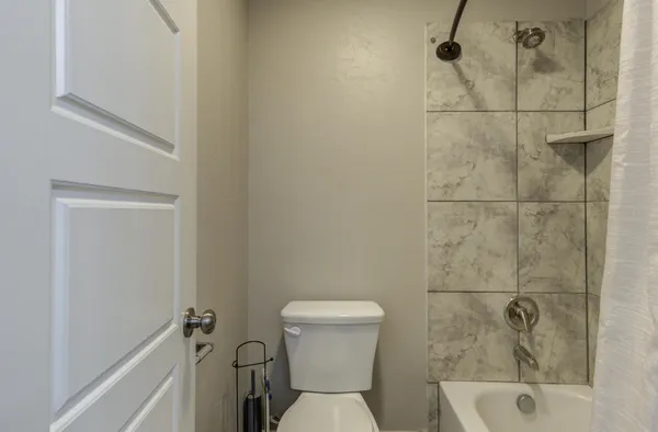 a view of bathroom with a shower and a bath tub