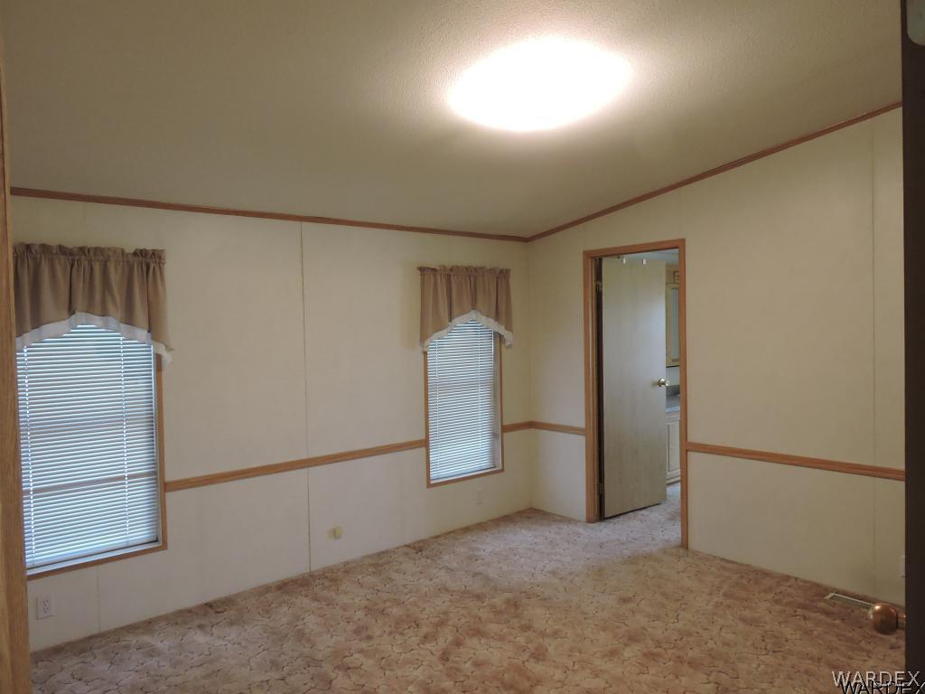 4053 Cove Road Golden Valley, AZ 86413 - Photo 13 of 20 an empty room with windows