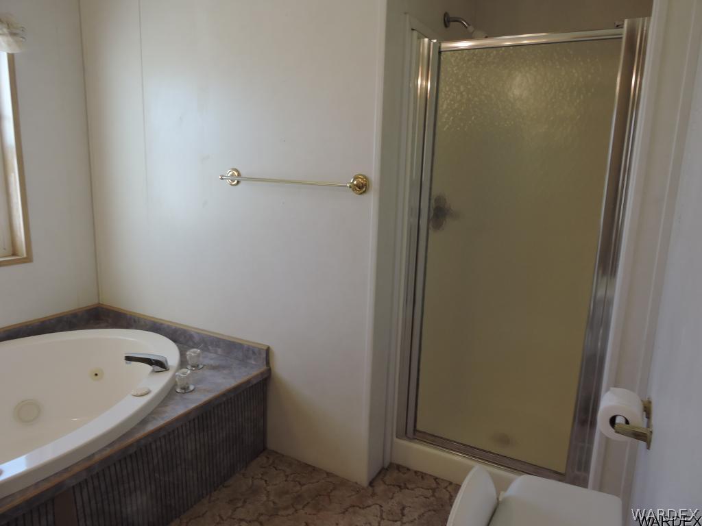 4053 Cove Road Golden Valley, AZ 86413 - Photo 14 of 20 a bathroom with a bathtub