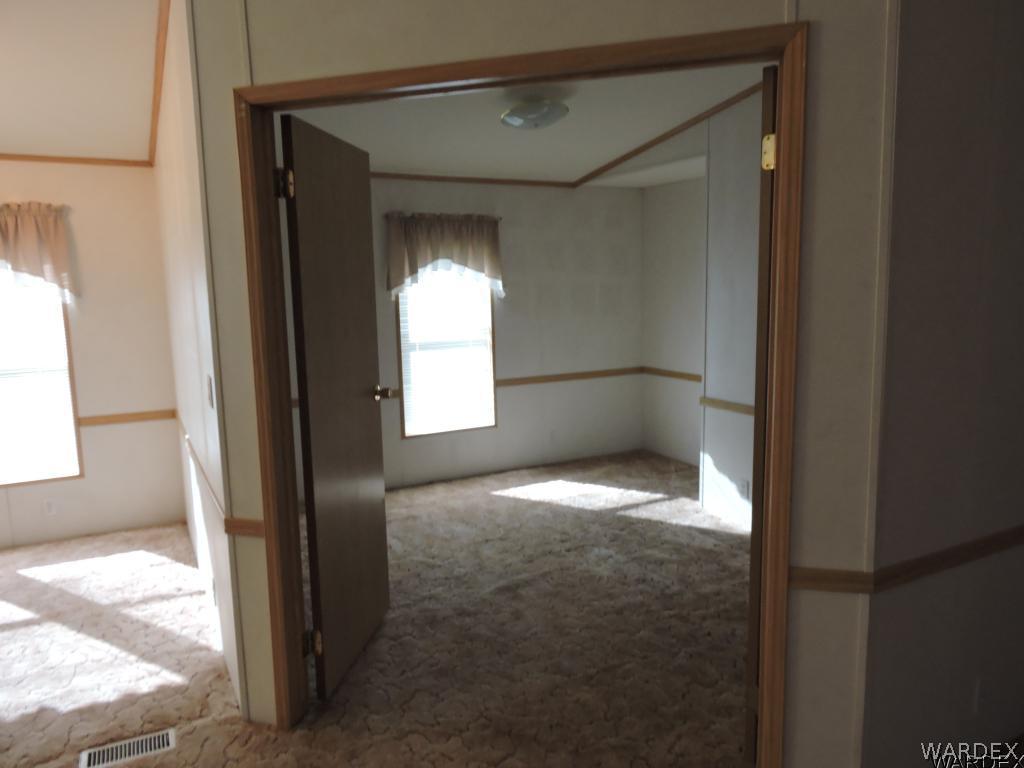 4053 Cove Road Golden Valley, AZ 86413 - Photo 17 of 20 a view of empty room with window