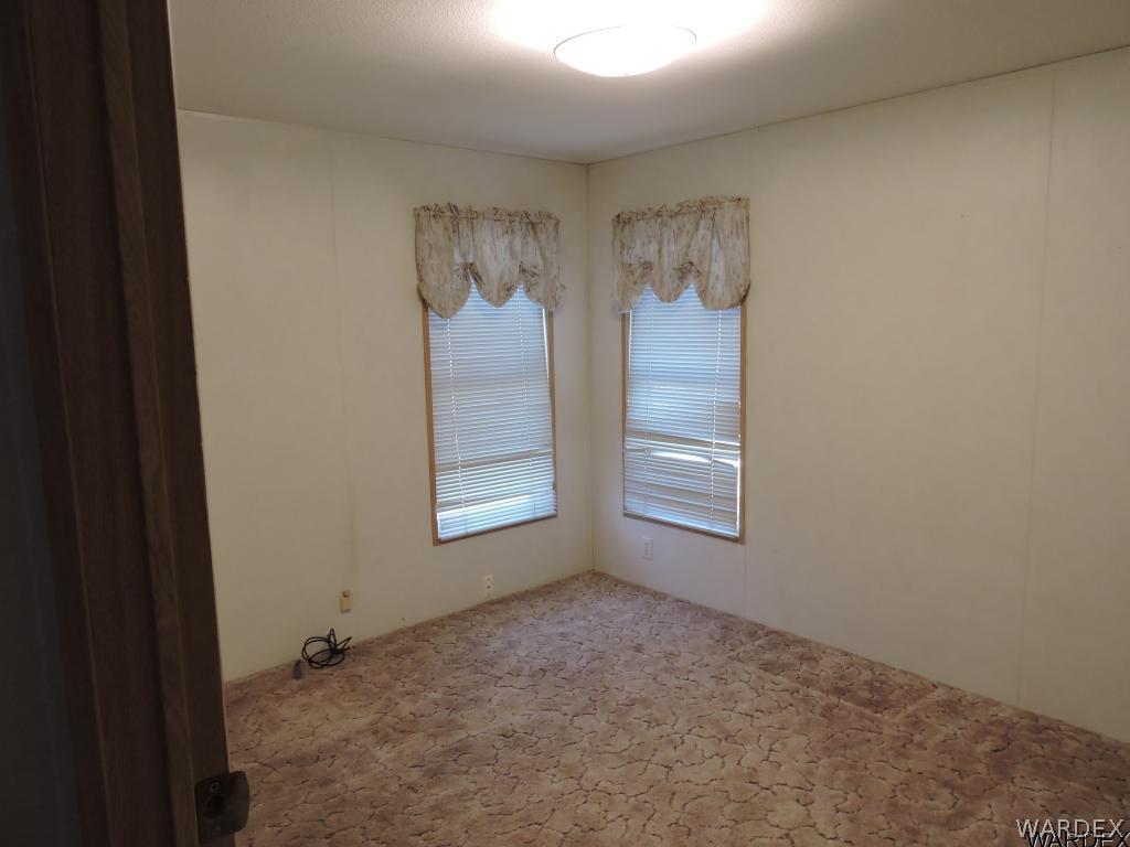 4053 Cove Road Golden Valley, AZ 86413 - Photo 19 of 20 a view of an empty room with a window