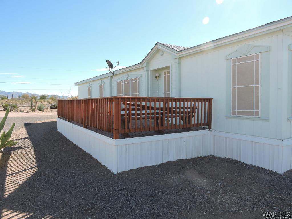 4053 Cove Road Golden Valley, AZ 86413 - Photo 2 of 20 a view of a house with a wooden deck